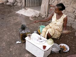 Una ragazza prepara il caffè tradizionale eritreo
